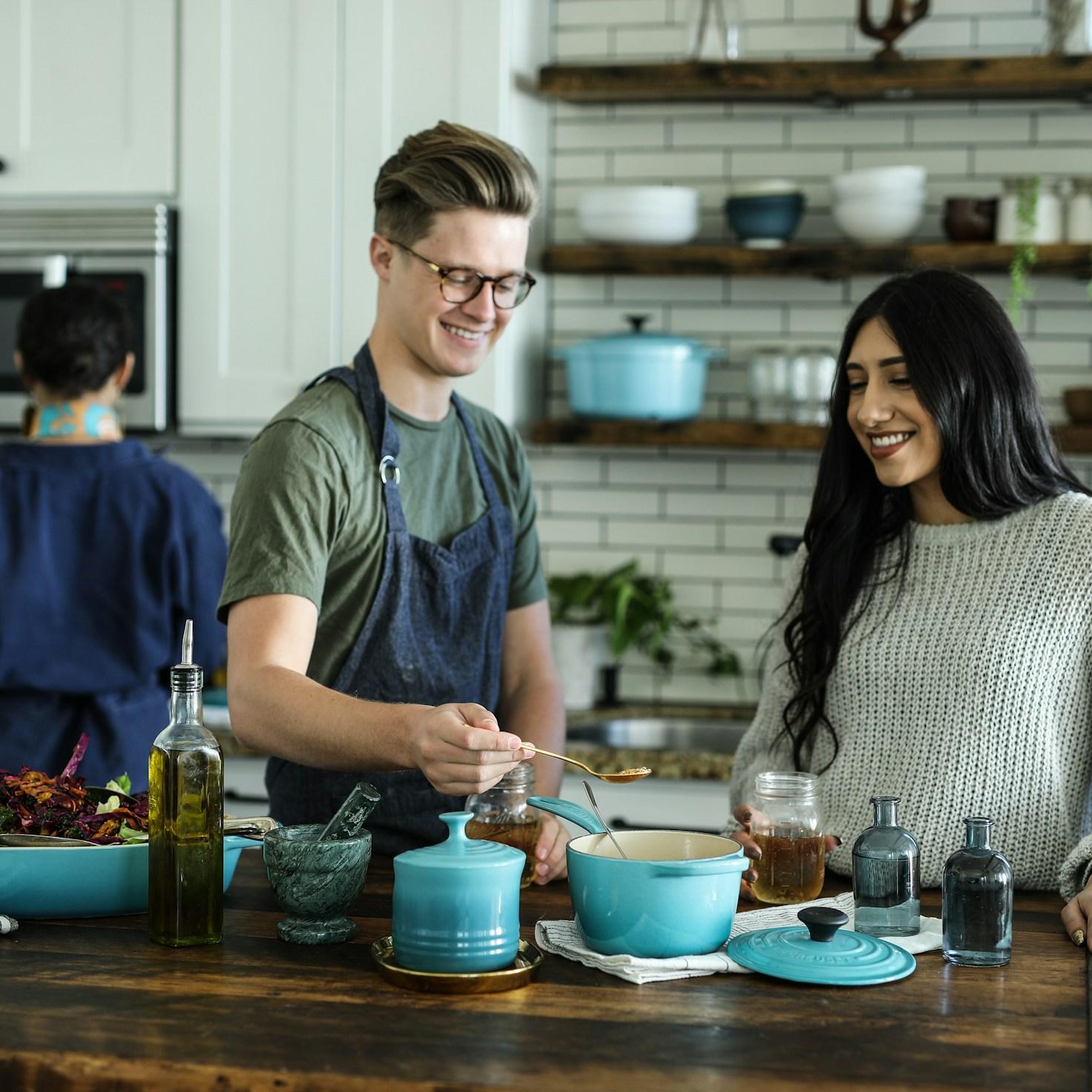 Community members collaborating in a contemporary kitchen space, sharing recipes and techniques